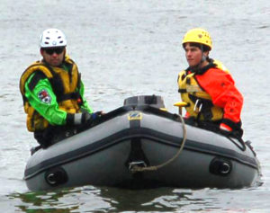 2 members of water rescue in the boat on water