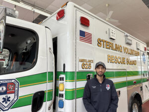 EMT in front of ambulance